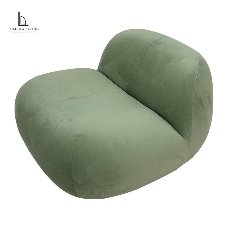 Sculptural Velvet Lounge Chair Sage green sculptural velvet lounge chair with a rounded low-profile design