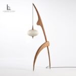 Sculptural wooden hanging floor lamp with suspended silk shade
