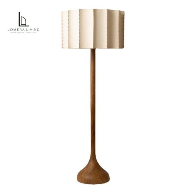 Sculptural wood table and floor lamps with ivory pleated fabric shades