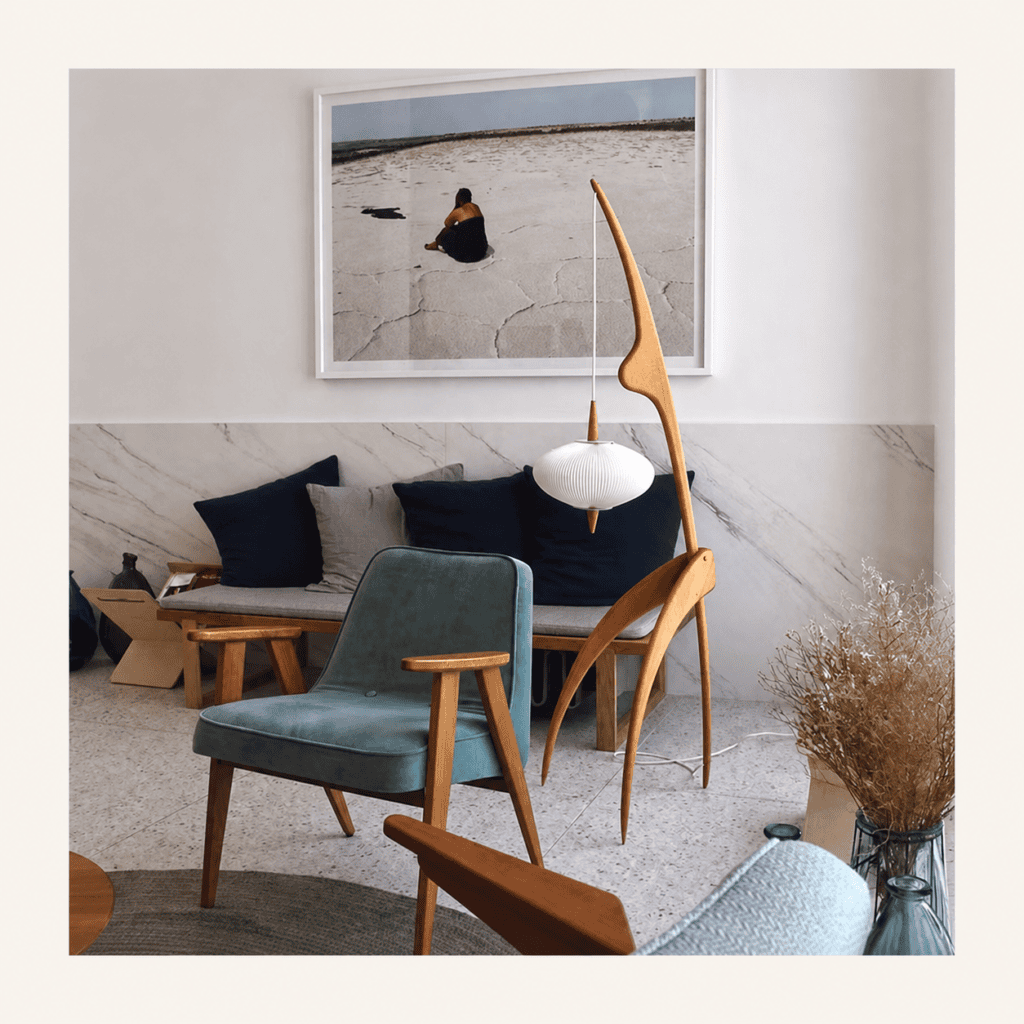 noguchi-hanging-floor-lamp-living-room-view-1 Sculptural wooden hanging floor lamp in a modern living room