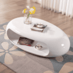 Sculptural white oval coffee table in a warm modern living room