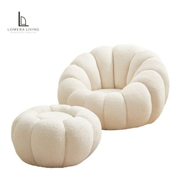 Cream bouclé petal lounge chair with matching round ottoman
